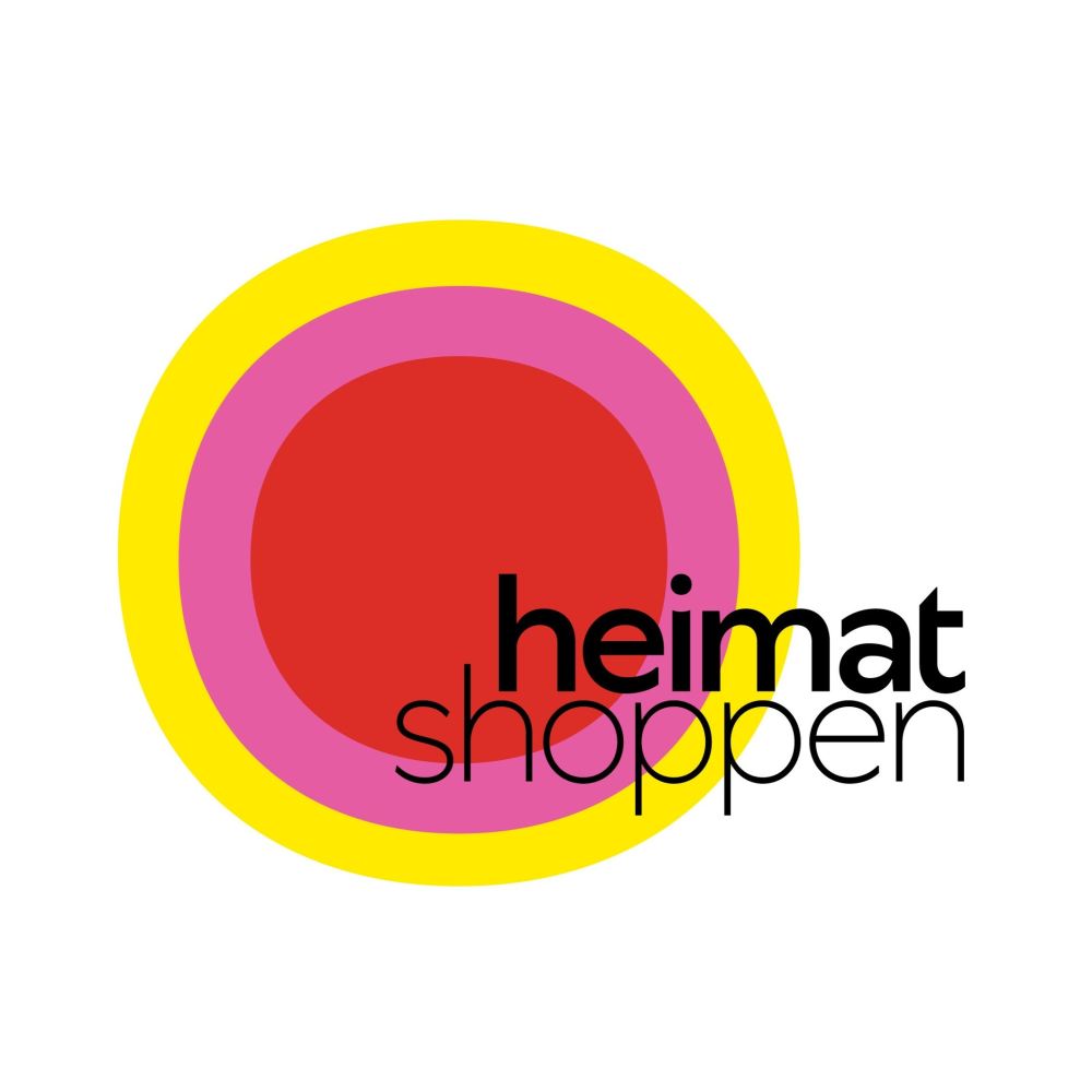 Logo der Initiative heimat shoppen. in großer gelber Kreis, darin ein kleiner pinker und ein noch kleiner roter Kreis. Im rechten unteren Bereich der Schriftzug 